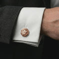 Load image into Gallery viewer, A rose gold plated lion profile cufflink is worn on a shirt cuff in a close-up lifestyle composition, highlighting its octagon frame and noble lion design.