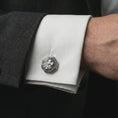 Load image into Gallery viewer, An oxidized lion profile cufflink is worn on a white shirt cuff in a close-up lifestyle shot, styled with a dark suit for a powerful formal look.