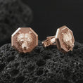 Load image into Gallery viewer, Rose gold plated bear head cufflinks are photographed on porous volcanic rock in a close-up studio composition with refined luxury lighting and detailed bear features.