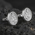 Load image into Gallery viewer, Polished silver Blessed Mother cufflinks are displayed on black volcanic rock in a premium macro studio close-up with detailed Catholic devotional artwork.