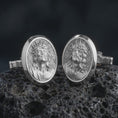 Load image into Gallery viewer, Polished silver Jesus Crown of Thorns cufflinks are displayed on black volcanic rock in a premium macro studio close-up with detailed Christian devotional artwork.