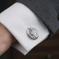Load image into Gallery viewer, Polished silver Saint Joseph cufflinks styled on a formal shirt cuff in a close-up lifestyle image, highlighting the detailed Catholic saint engraving during formal wear.