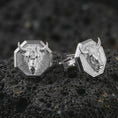 Load image into Gallery viewer, Polished silver bull head cufflinks are displayed on black volcanic rock in a premium macro studio close-up with detailed horns and clean geometric edges.
