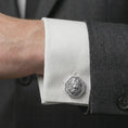 Load image into Gallery viewer, A polished silver lion head cufflink is worn on a shirt cuff in a premium close-up lifestyle image, showing the sculpted roaring lion face clearly.