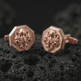 Load image into Gallery viewer, Rose gold plated octopus cufflinks are photographed on porous volcanic rock in a close-up studio composition with refined luxury lighting and detailed ocean-inspired features.