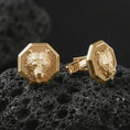 Load image into Gallery viewer, Gold plated bear head cufflinks sit on textured volcanic rock in a dramatic studio macro shot, highlighting the powerful wildlife motif and formal accessory design.