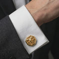 Load image into Gallery viewer, A gold plated ram skull cufflink is worn on a white cuff in a close-up lifestyle shot, styled as a meaningful Aries gift for men.