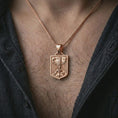 Load image into Gallery viewer, Rose gold plated German eagle shield pendant necklace worn on the chest, close-up lifestyle shot featuring the bold heraldic eagle design with warm rose gold tones.