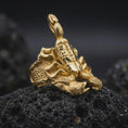 Load image into Gallery viewer, A gold plated scorpion claw ring rests on rugged volcanic rock, featuring a bold 3D scorpion with layered armor plates, sharp stinger, and detailed textured legs in a luxury macro studio close-up.