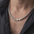 Load image into Gallery viewer, A 6mm Byzantine chain necklace with an oxidized finish is worn on a man’s neck, displaying dark recessed link details and a bold masculine silhouette in a close-up lifestyle shot.