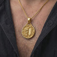 Load image into Gallery viewer, A gold plated Templar Knight pendant is worn on the neck, highlighting the medieval warrior relief, cross-bearing shield, fortified background, and symbolic Christian jewelry style in a refined close-up lifestyle shot.