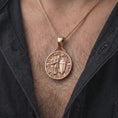 Load image into Gallery viewer, The rose gold plated crusader knight pendant is worn on the neck, showcasing the detailed armor, sword, cross shield, architectural relief, and distinctive medieval warrior jewelry design.