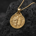 Load image into Gallery viewer, A gold plated Templar Knight necklace rests on rugged volcanic rock, showcasing the medieval warrior, cross shield, castle background, and dimensional historical relief in a luxury macro studio close-up.