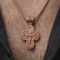 Load image into Gallery viewer, The rose gold plated Saint Michael necklace is worn on the neck, showcasing the detailed double sided cross pendant, decorative bail, and bold faith-inspired jewelry design in an elegant lifestyle image.