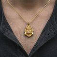 Load image into Gallery viewer, A gold plated gorilla samurai necklace worn on a man's chest, highlighting the elaborate warrior helmet, curved horns, powerful gorilla expression, and distinctive Japanese-inspired jewelry.