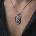 Load image into Gallery viewer, Oxidized sterling silver bear and cub necklace worn on the chest, showing the two detailed bear faces, textured dog tag medallion, and symbolic family protection design.