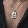 Load image into Gallery viewer, Polished silver grizzly bear and cub pendant worn on the chest, featuring sculpted wildlife details and a meaningful parent-child bond in a rugged dog tag necklace.