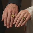 Load image into Gallery viewer, Gold plated Persian Shir o Khorshid ring worn on the finger, highlighting the historic Iranian lion and sun symbol, sculpted sword-bearing lion, decorative ring shoulders, and bold heritage-inspired signet design.