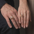 Load image into Gallery viewer, Rose gold plated 925 sterling silver matching bear head statement rings worn on the fingers of a man and woman together, highlighting fierce roaring bear sculptures, lifelike fur textures, open jaws, sculpted ears, and coordinated rose gold plated finishes.