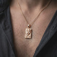 Load image into Gallery viewer, Rose gold plated Gemini twins pendant worn on the chest, showcasing the sculpted dual face composition, angular geometric detailing, and elegant Gemini astrology jewelry aesthetic.