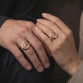 Load image into Gallery viewer, Rose gold plated lion family signet ring worn on the hand, showcasing the tender lion family portrait, raised circular frame, detailed fur textures, and symbolic parental love necklace-free jewelry design.