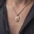 Load image into Gallery viewer, Rose gold plated leopard necklace worn on the chest, showcasing the three-dimensional prowling leopard with intricate body markings, powerful paws, raised tail, textured pendant face, and distinctive wild animal jewelry aesthetic.