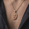 Load image into Gallery viewer, Rose Gold Plated Saint Paul Apostle necklace displayed on a man's chest, emphasizing the traditional saint figure and cross-decorated bail.