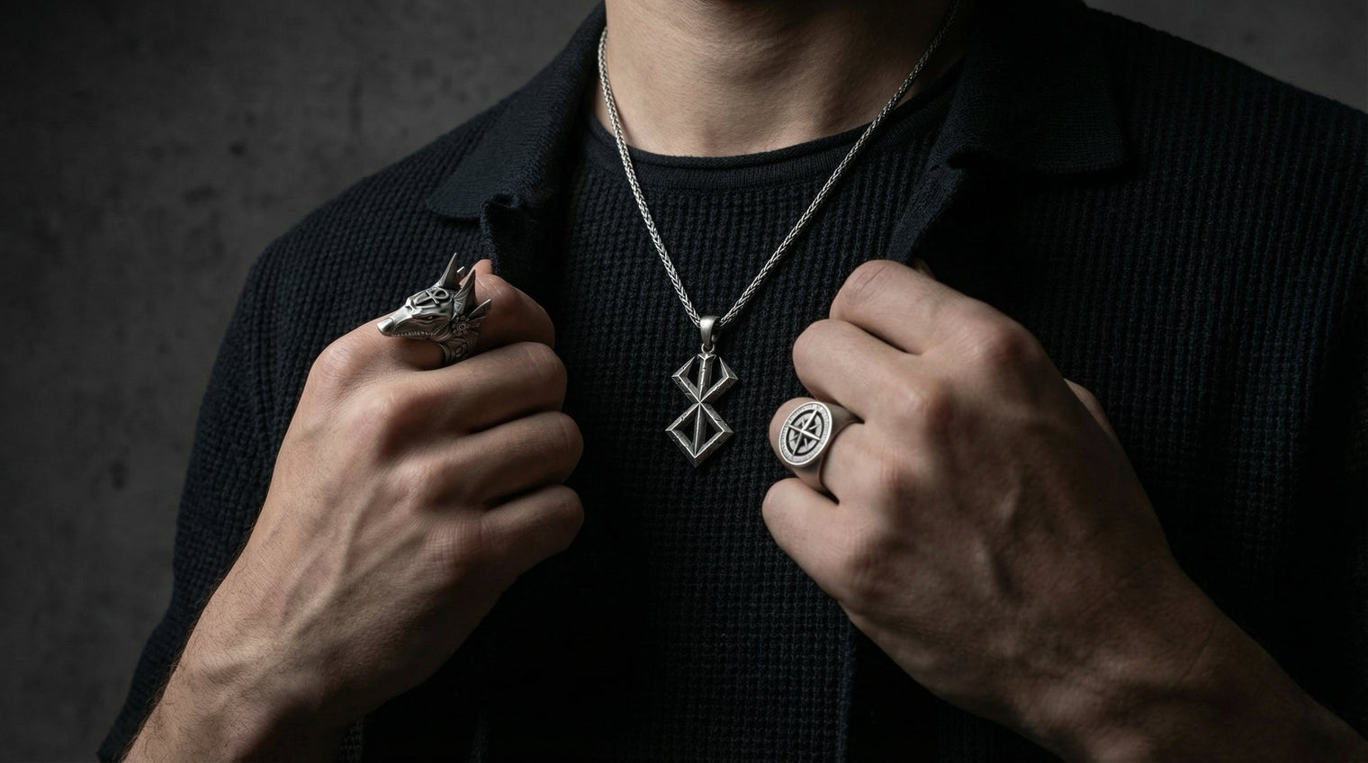 Men’s silver jewelry featuring symbolic rings and necklaces with handcrafted detail