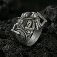 Load image into Gallery viewer, Sterling silver Spartan warrior ring with an oxidized finish, sculptural battle scene featuring armored Greek soldiers, shield and sword detail, macro on black volcanic rock
