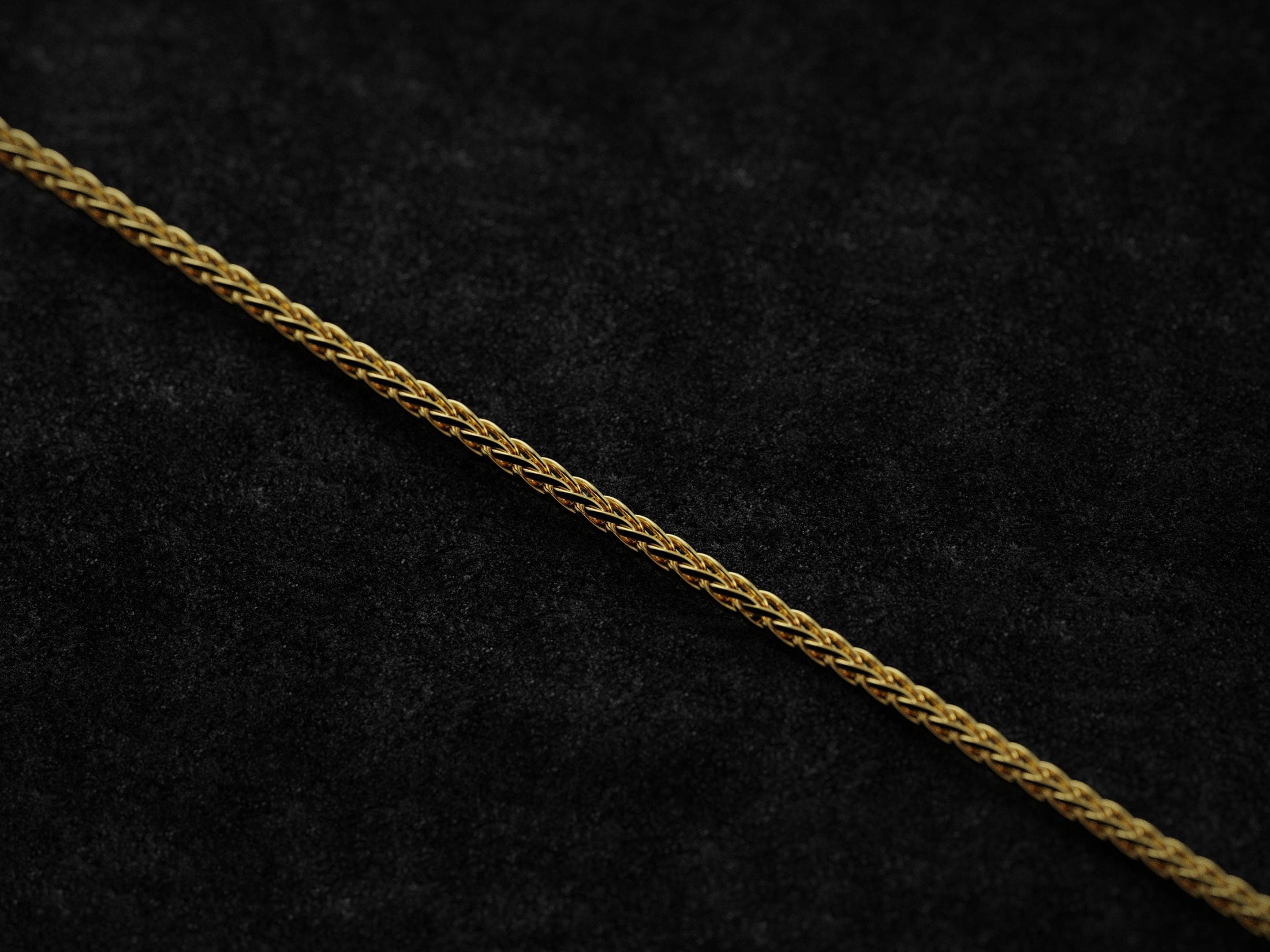 Gold-plated Spiga chain adding warmth and elegance to the look.