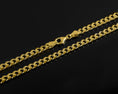 Load image into Gallery viewer, Close-up of 5.75mm gold Cuban chain, perfect everyday necklace.
