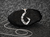 Rhodium-plated scorpion pendant, bold and minimal design.