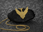 Gold-plated Atreides necklace, regal sci-fi accessory.