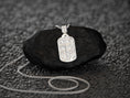 Load image into Gallery viewer, Rhodium-plated INRI cross charm, sleek spiritual jewelry.
