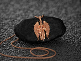 Rose gold angel protection necklace, soft and meaningful tone.