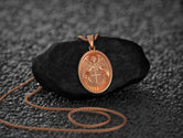 Rose gold angel protection necklace, oval shape, elegant finish.
