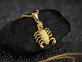 Gold-plated armored scorpion pendant, strong animal symbolism.