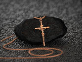 Rose gold crucifix necklace, warm devotional jewelry.