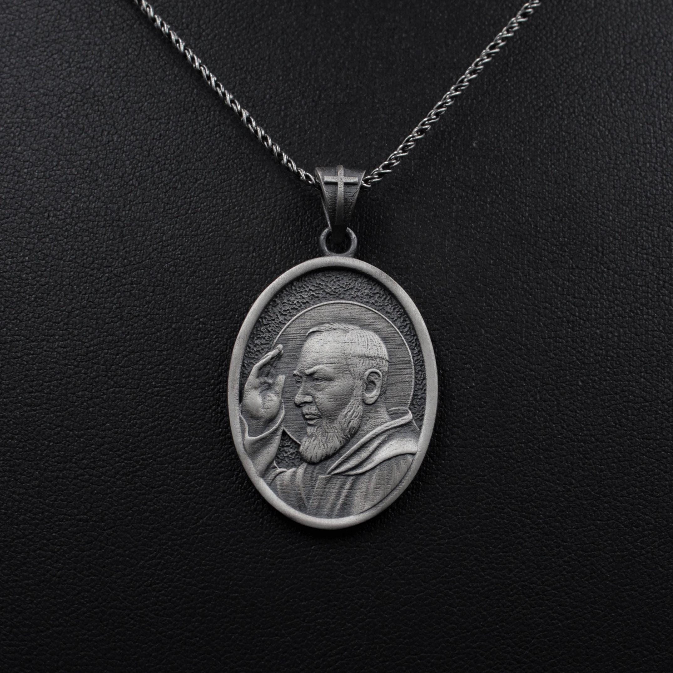 Detailed religious medal featuring Saint Padre Pio in silver finish