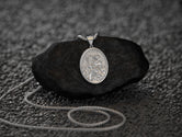Rhodium-plated St. Christopher charm, polished and elegant.