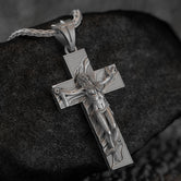 Oxidized silver pendant featuring a bound female figure on a symbolic cross, gothic style,