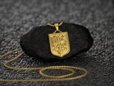 Close-up of golden eagle crest necklace inspired by Albanian coat of arms,