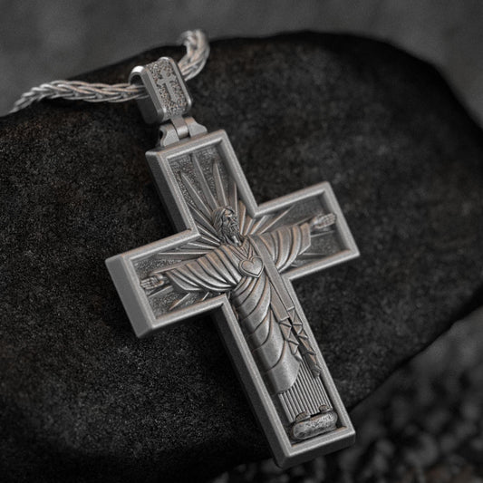 Front of Cristo Protetor cross pendant with inscription,
