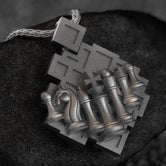 Chess pendant with knight and pawns on board,