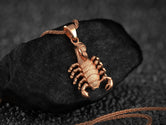 Rose gold scorpion necklace, bold and stylish.