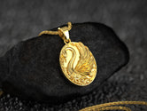 Gold-plated swan charm necklace, radiant bird design.