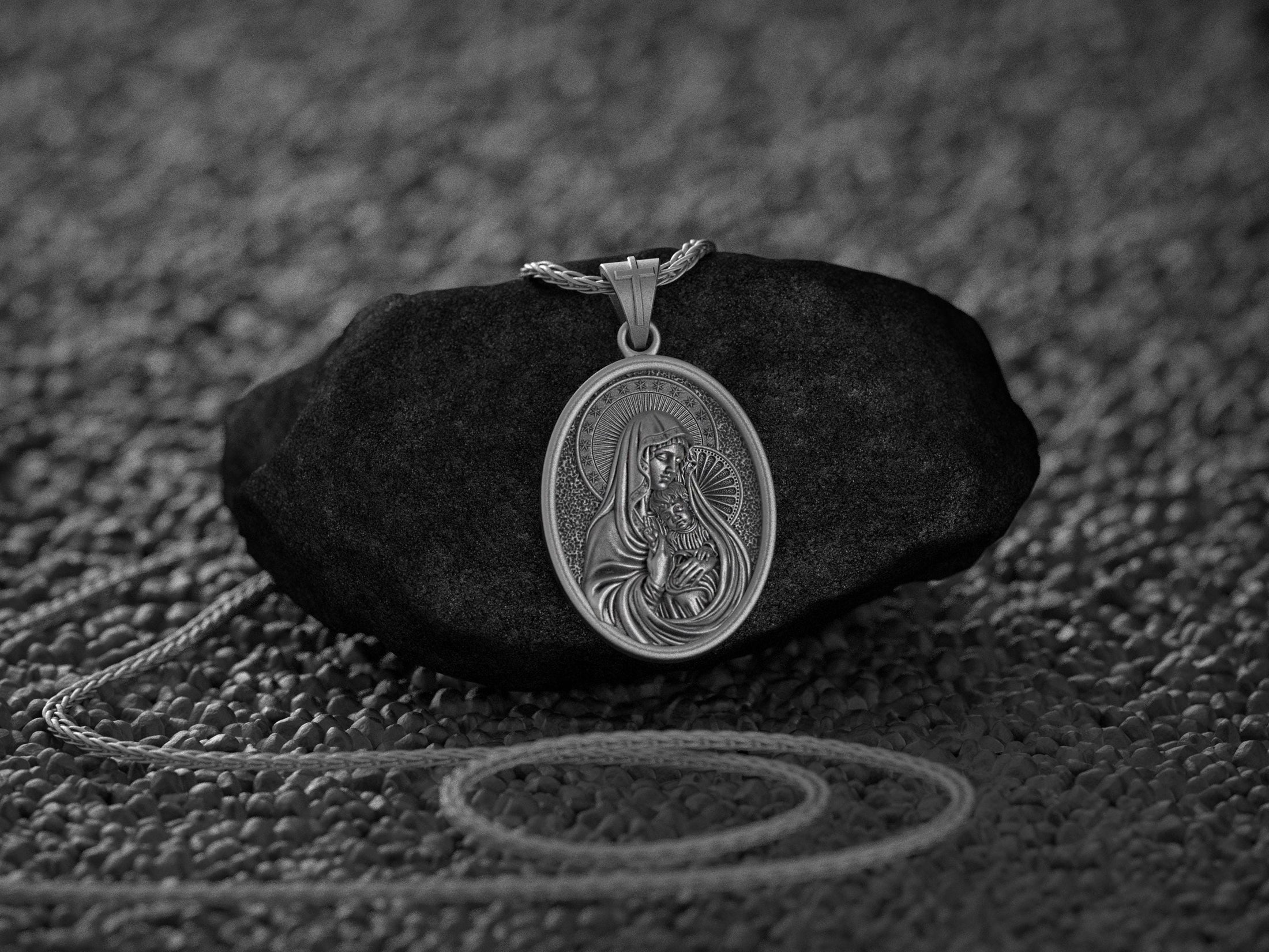 Detailed religious medal of Madonna holding Baby Jesus with halo