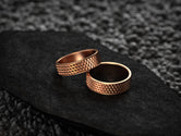 Rose gold unisex rings with bold structured surface and comfort interior