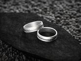 Silver feather wedding bands with comfort fit design