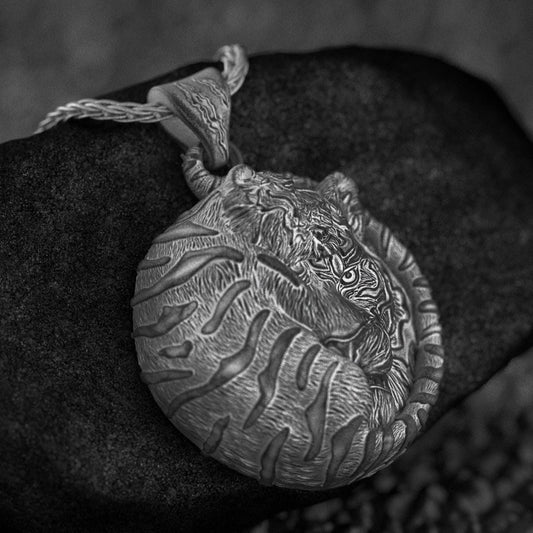 Sleeping tiger curled pendant in silver,